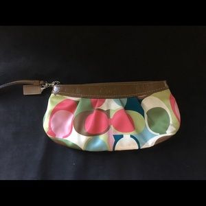 Coach printed clutch with wrist handle